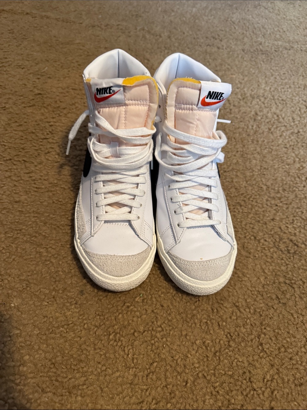 Nike White High-Top Sneakers with Black Swoosh and Pink Tongue